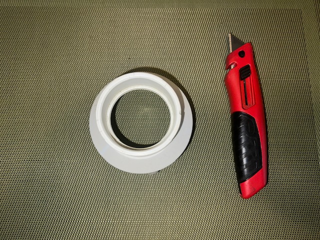 PVC pipe opening used to hold tennis ball while cutting